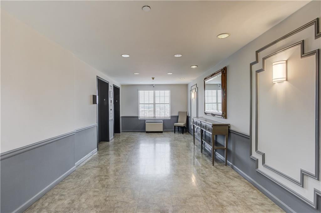 970 Sidney Marcus Boulevard Northeast, Unit 2403 Atlanta, GA 30324 - Photo 27 of 41 a view of a livingroom with furniture and windows