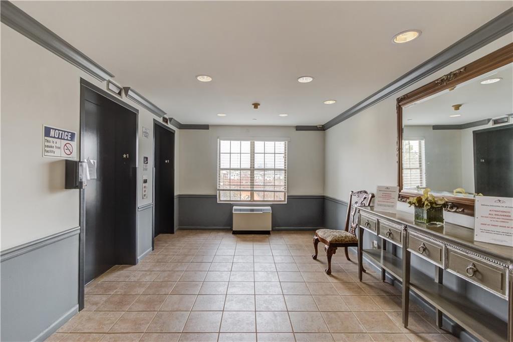 970 Sidney Marcus Boulevard Northeast, Unit 2403 Atlanta, GA 30324 - Photo 30 of 41 a lobby with furniture and window