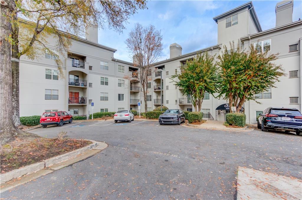 970 Sidney Marcus Boulevard Northeast, Unit 2403 Atlanta, GA 30324 - Photo 3 of 41 a view of a street with a cars parked in front of it