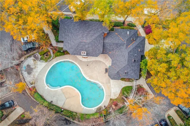 a view of a patio with iron fence