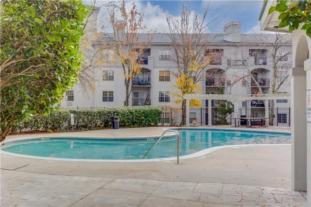 an aerial view of a house with a swimming pool
