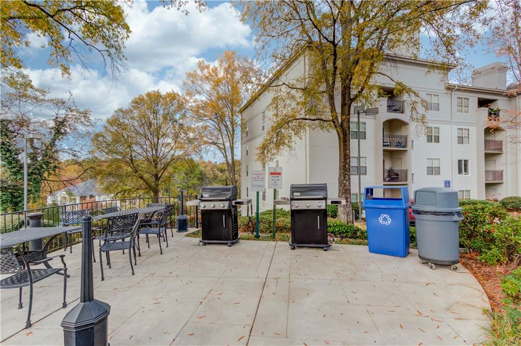 970 Sidney Marcus Boulevard Northeast, Unit 2403 Atlanta, GA 30324 - Photo 37 of 41 a view of a patio with iron fence