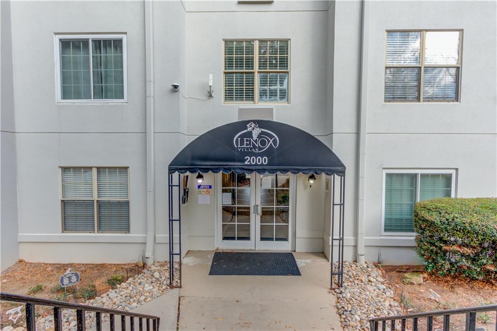 970 Sidney Marcus Boulevard Northeast, Unit 2403 Atlanta, GA 30324 - Photo 6 of 41 a front view of a house with a yard