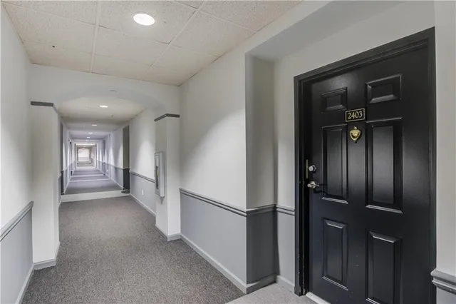 a view of a hallway with closet area