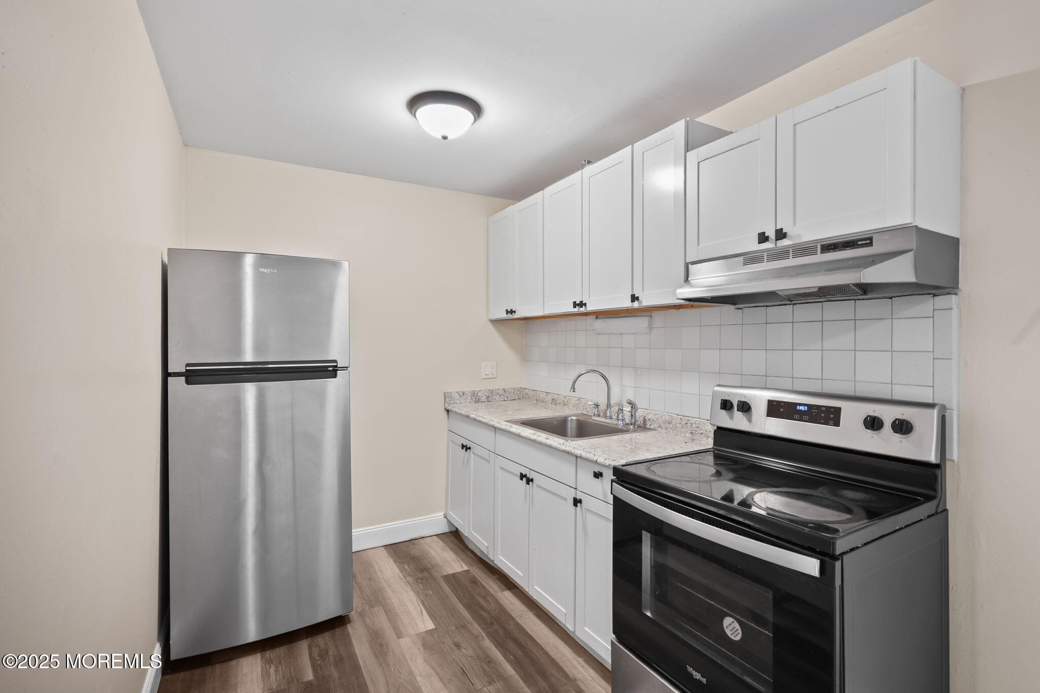 175 Buckelew Avenue, Unit BLDG 2 14 Jamesburg, NJ 08831 - Photo 18 of 31 a kitchen with a sink stove and refrigerator