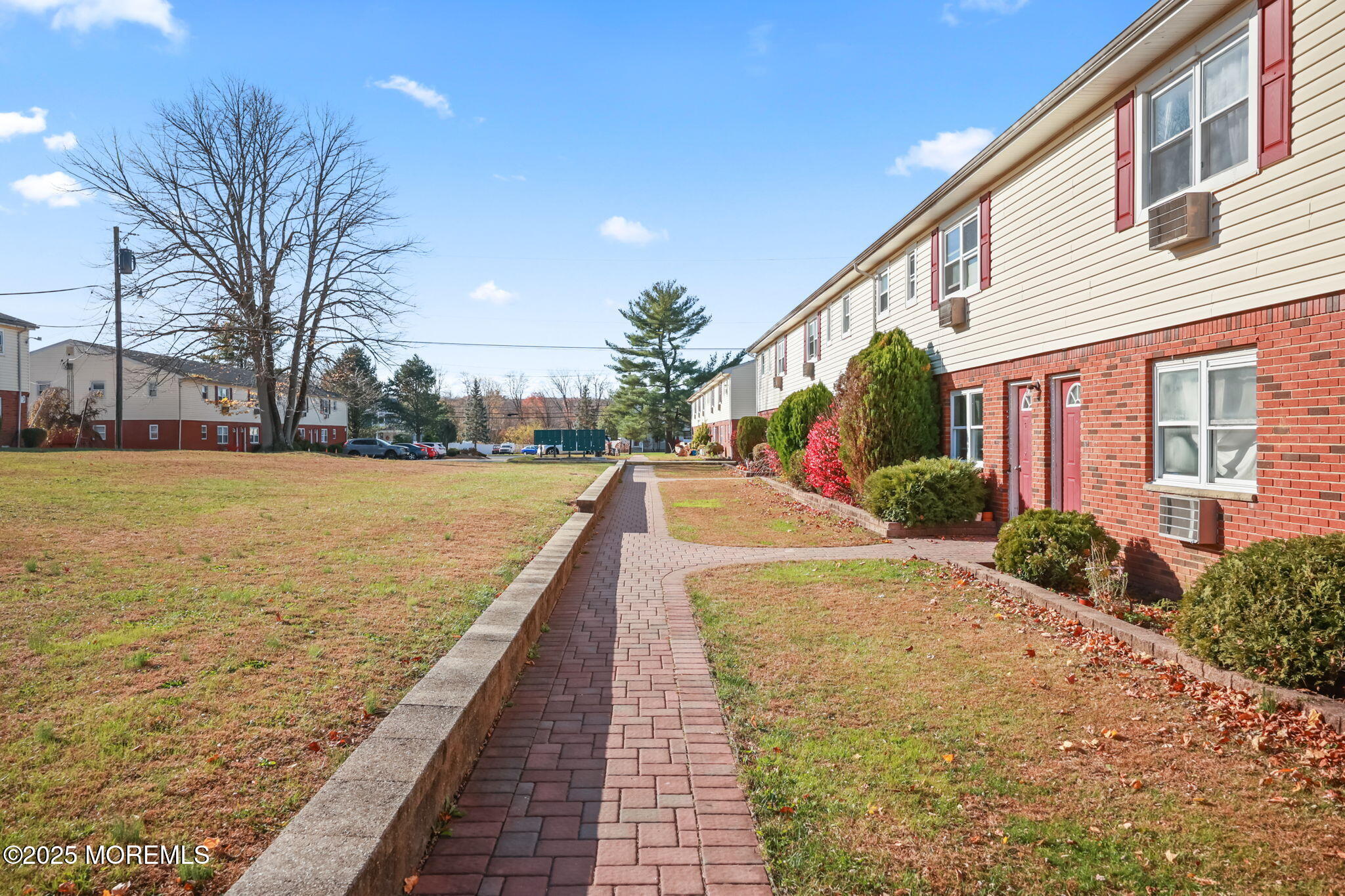 175 Buckelew Avenue, Unit BLDG 2 14 Jamesburg, NJ 08831 - Photo 2 of 31 a view of a patio with a yard