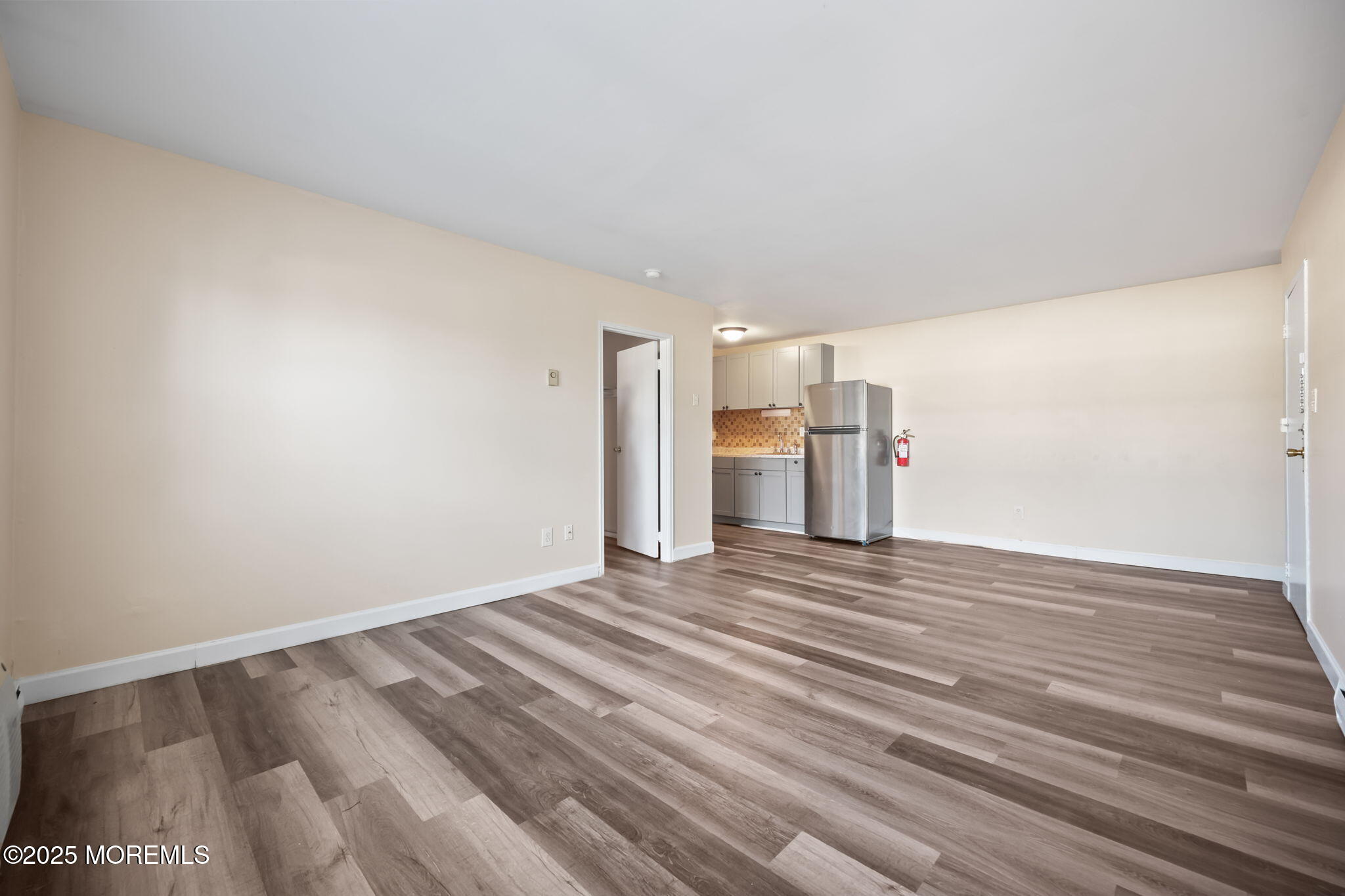 175 Buckelew Avenue, Unit BLDG 2 14 Jamesburg, NJ 08831 - Photo 10 of 31 a view of empty room with wooden floor