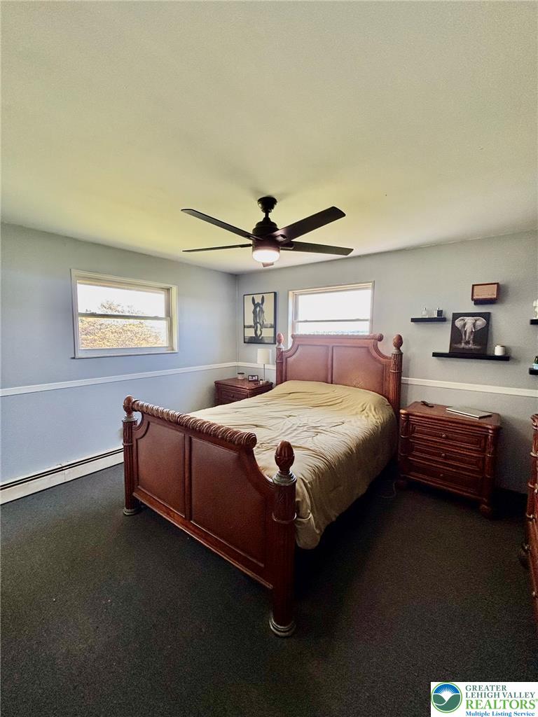 8813 Bluejay Road Kempton, PA 19529 - Photo 16 of 23 This cozy bedroom offers a tranquil retreat with soft lighting and ample natural light.