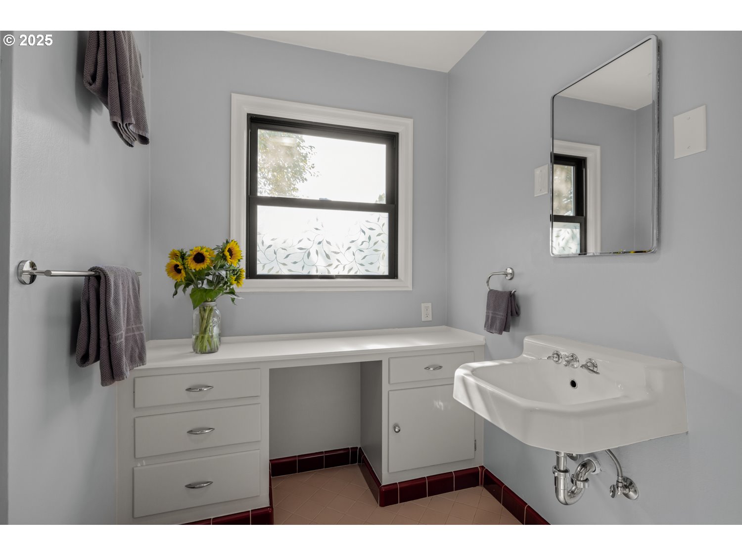 4016 Southeast Cora Street Portland, OR 97202 - Photo 16 of 30 a bathroom with a sink a toilet and a mirror