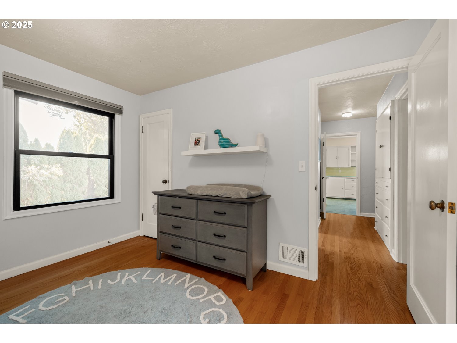 4016 Southeast Cora Street Portland, OR 97202 - Photo 18 of 30 a bedroom with a bed and a window