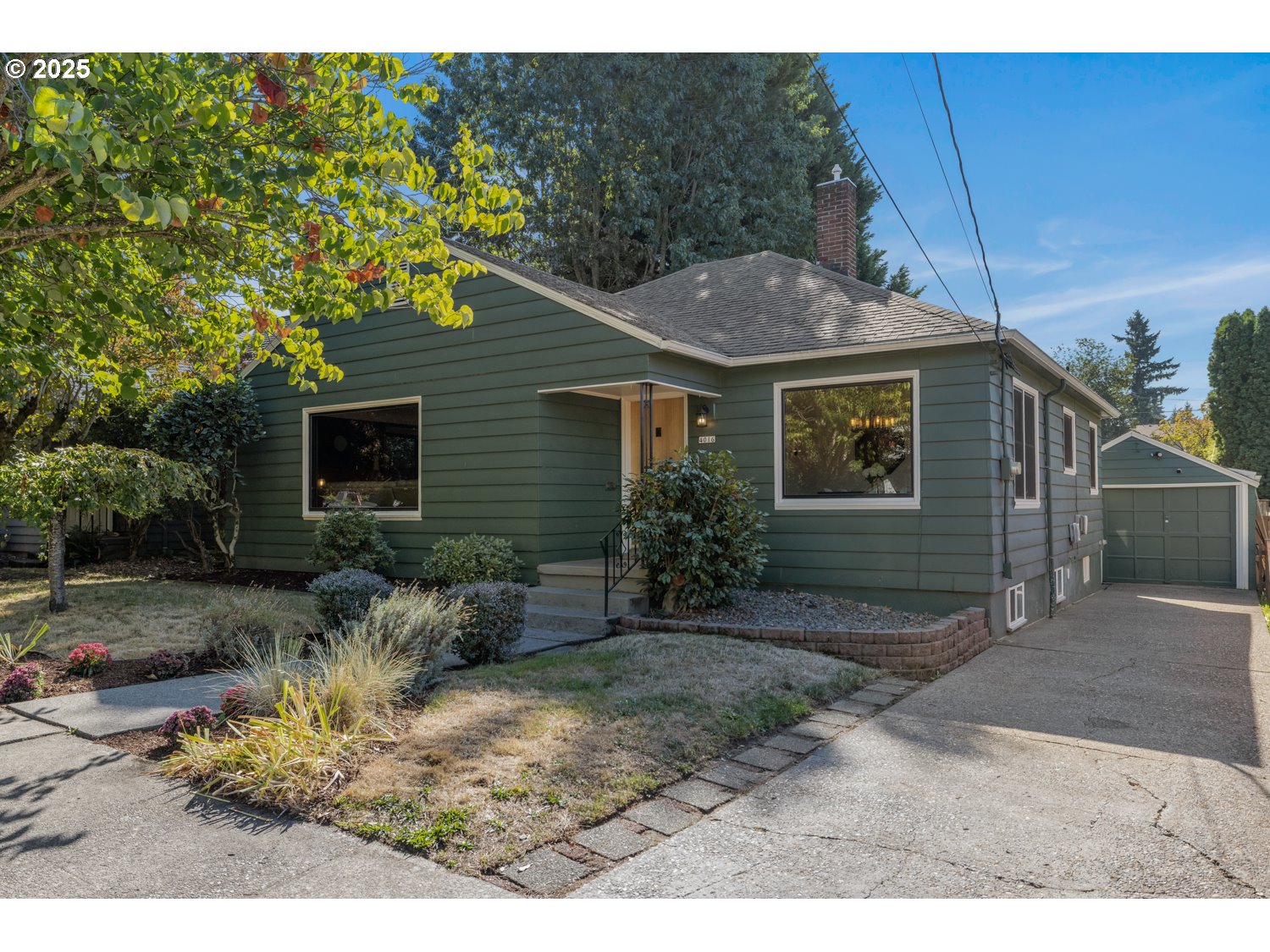 4016 Southeast Cora Street Portland, OR 97202 - Photo 2 of 30 a view of a house with a yard