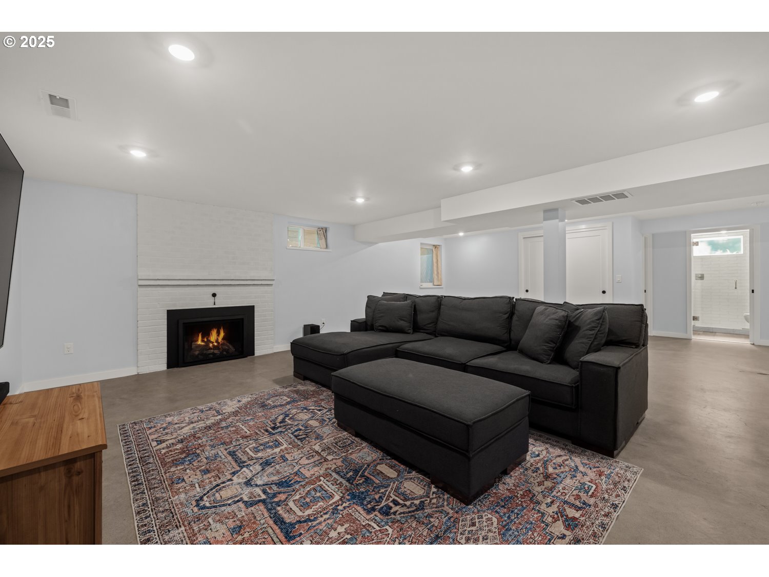 4016 Southeast Cora Street Portland, OR 97202 - Photo 23 of 30 a living room with furniture and a fireplace