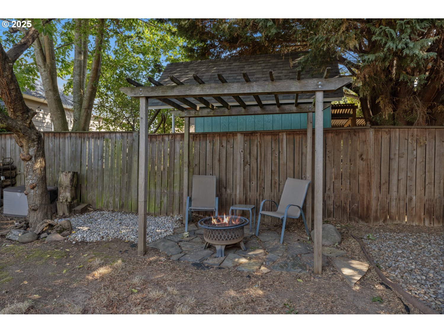 4016 Southeast Cora Street Portland, OR 97202 - Photo 30 of 30 a view of a patio with a table and chairs