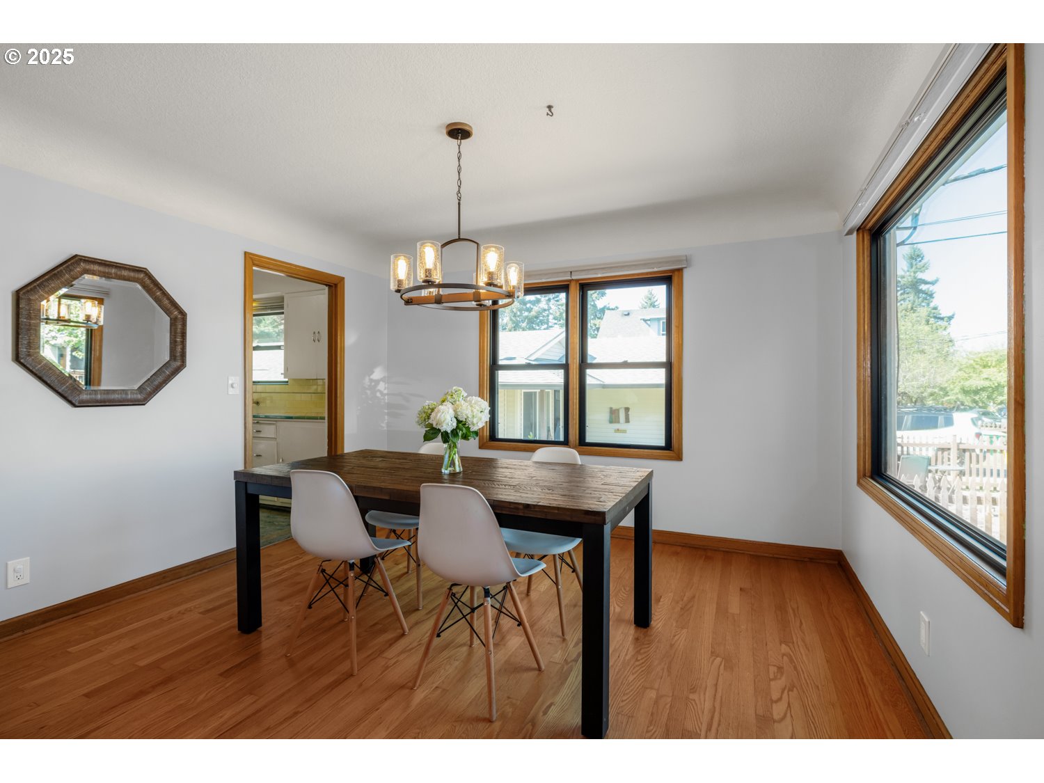 4016 Southeast Cora Street Portland, OR 97202 - Photo 7 of 30 a view of a dining room with furniture window and wooden floor