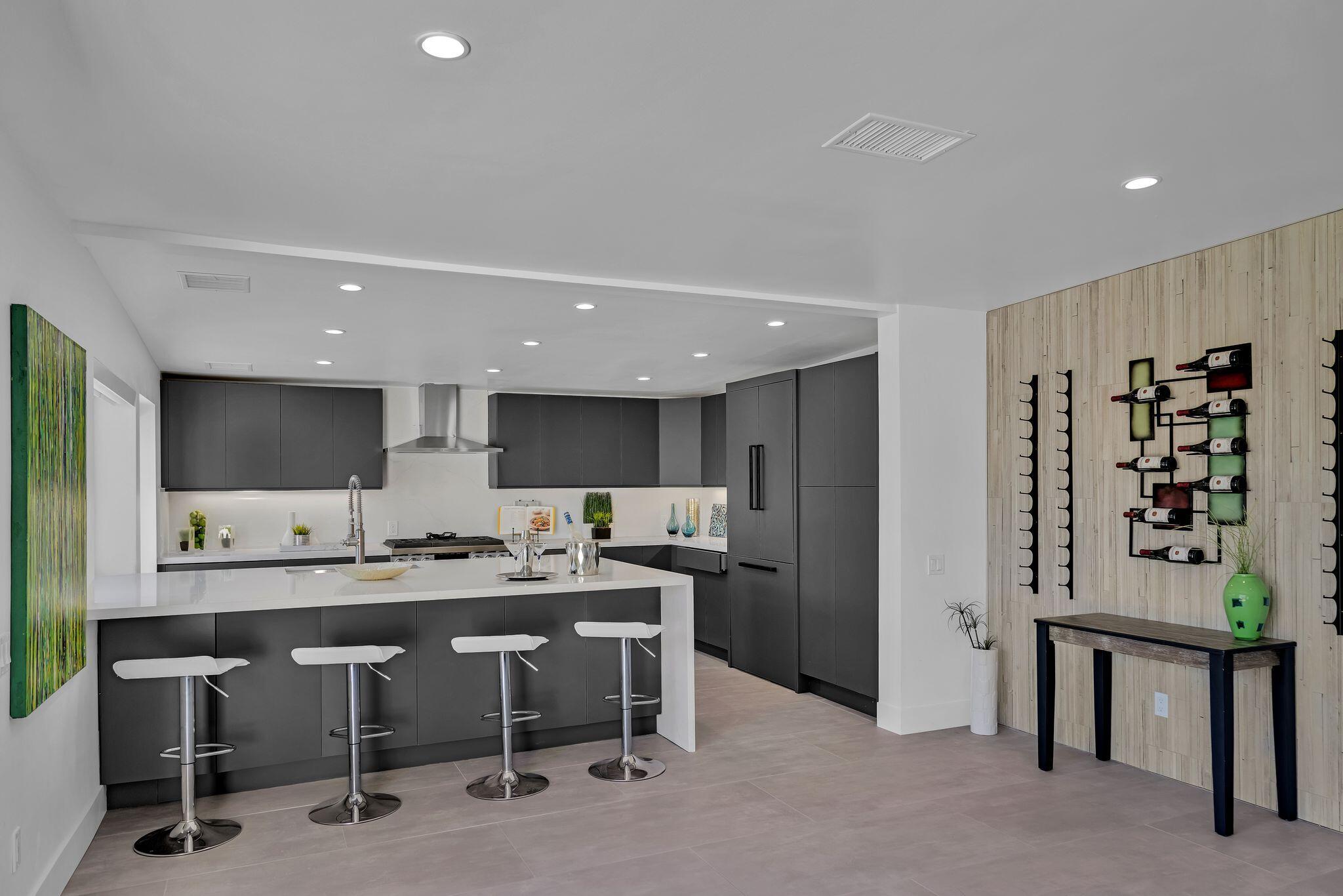 690 South Grenfall Road Palm Springs, CA 92264 - Photo 25 of 92 a kitchen with a table and chairs in it