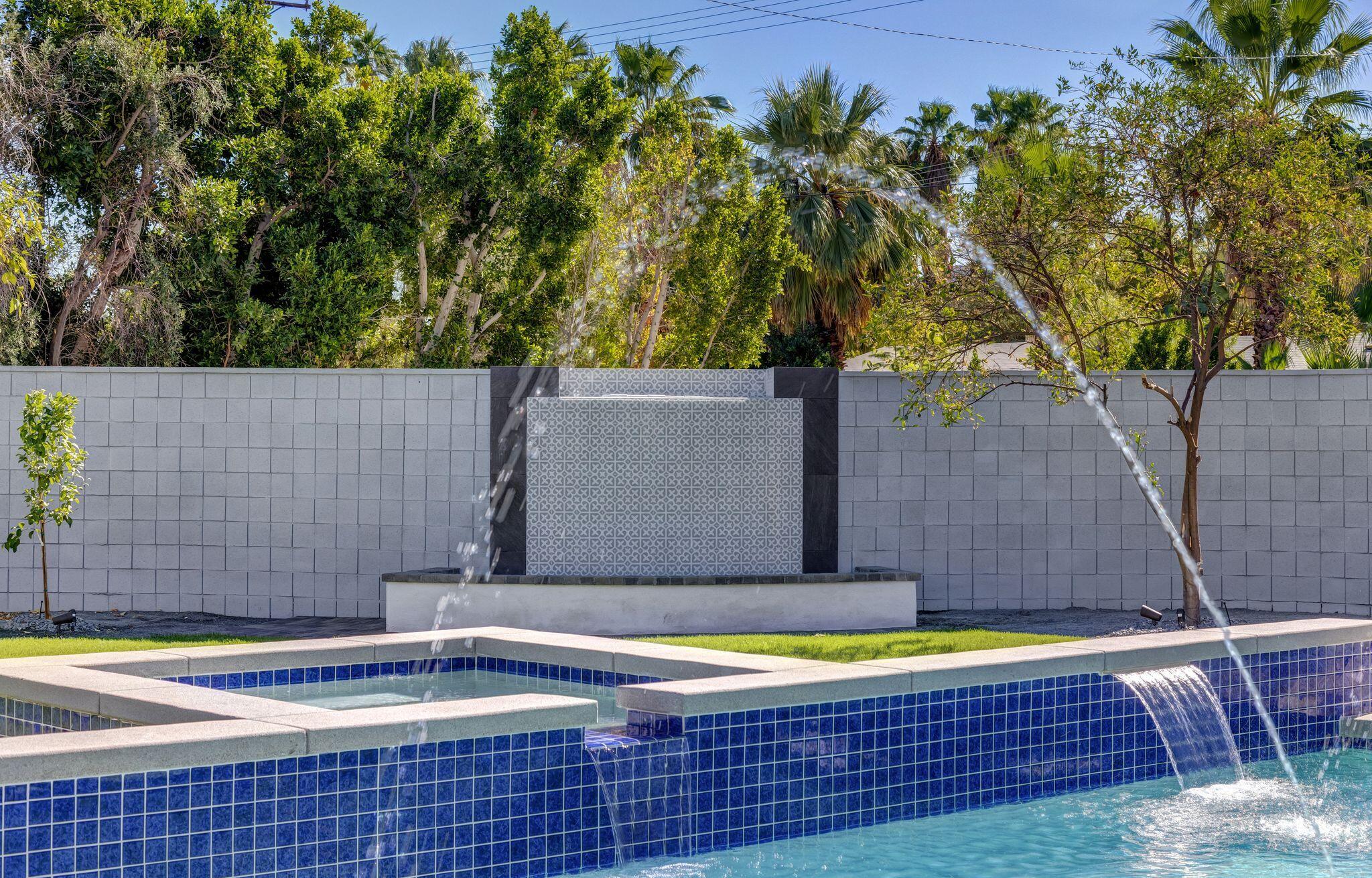690 South Grenfall Road Palm Springs, CA 92264 - Photo 33 of 92 a view of a swimming pool with an outdoor space and seating area
