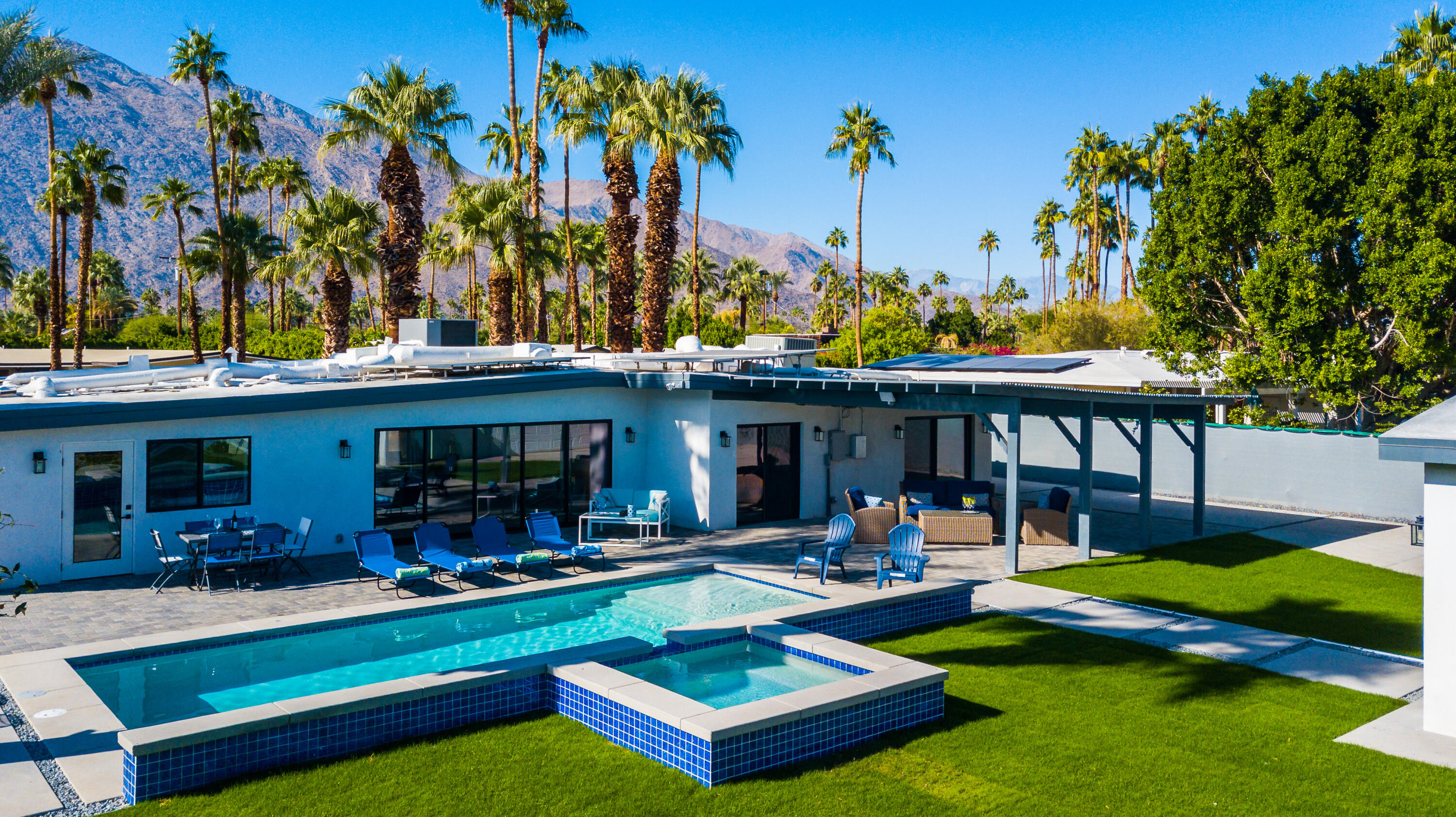 690 South Grenfall Road Palm Springs, CA 92264 - Photo 37 of 92 a front view of a house with garden and sitting area