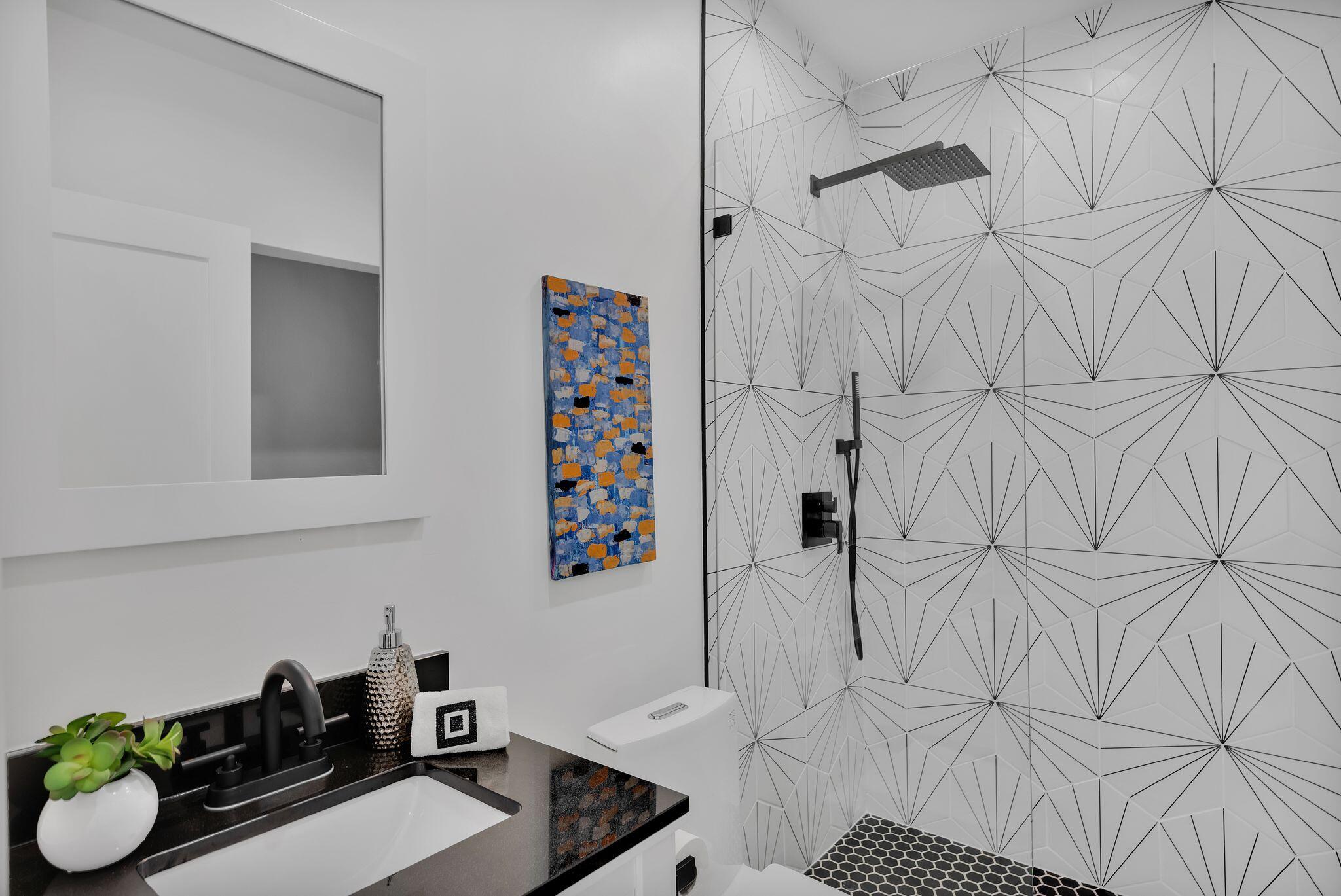 690 South Grenfall Road Palm Springs, CA 92264 - Photo 47 of 92 a bathroom with a sink and a shower curtain