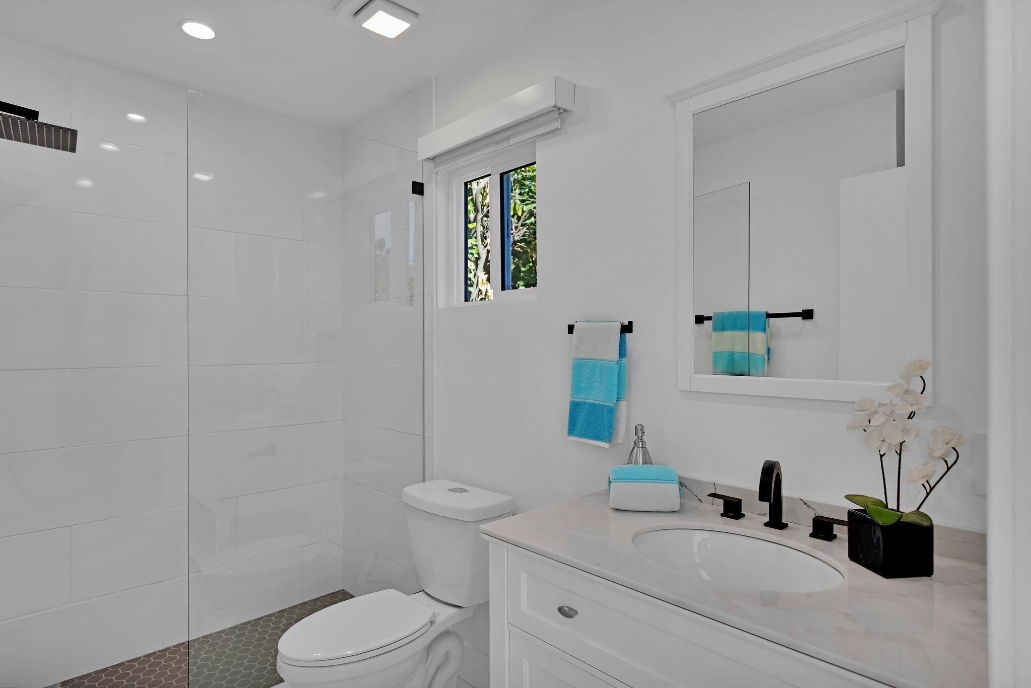 690 South Grenfall Road Palm Springs, CA 92264 - Photo 51 of 92 a bathroom with a granite countertop sink a toilet and a mirror