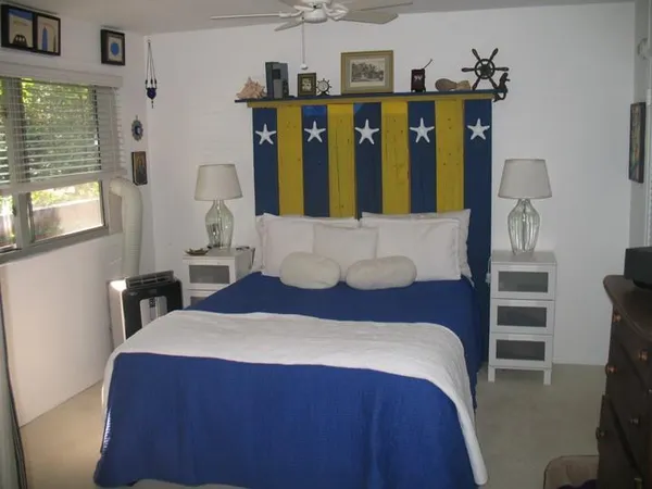 a bedroom with a large bed and a window