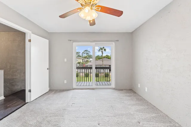 an empty room with windows and outdoor view