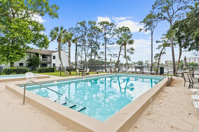 a view of swimming pool with chairs