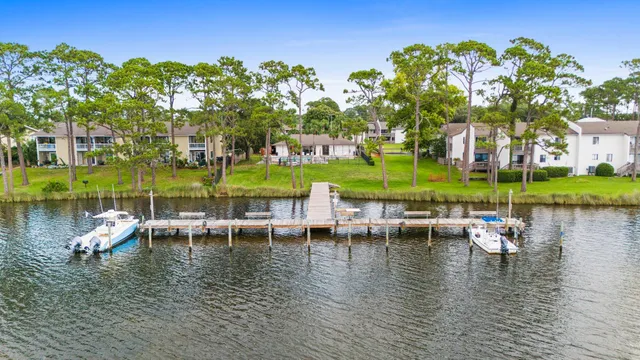a view of a lake with a house swimming pool and outdoor space