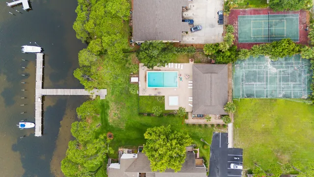 an aerial view of a house with a yard