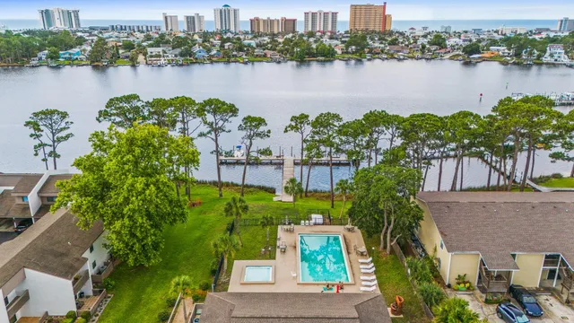 an aerial view of a house with a lake view