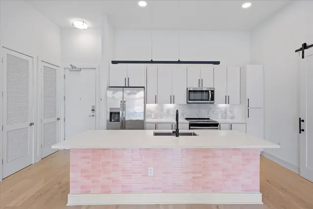 a large kitchen with cabinets
