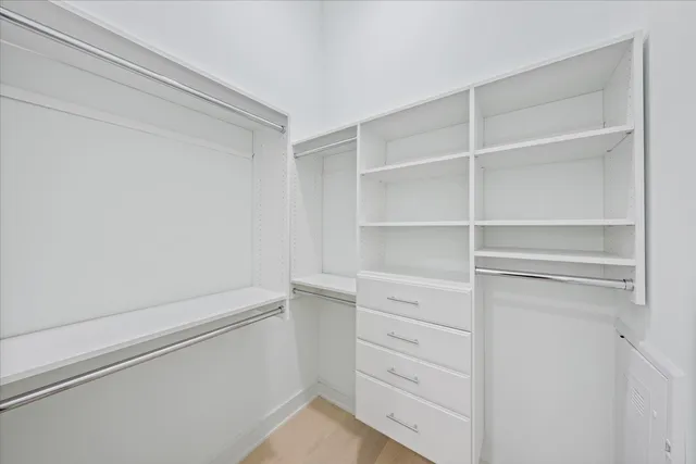 a view of an empty walk in closet