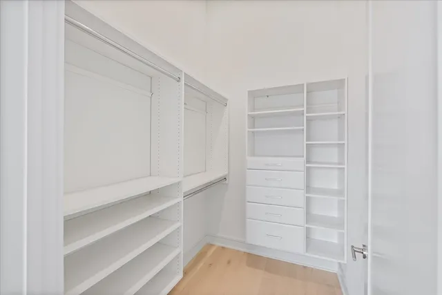 a view of an empty walk in closet