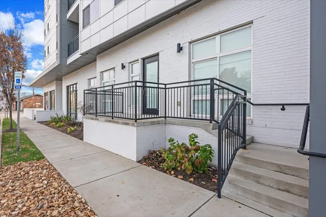 a view of a house with wooden fence