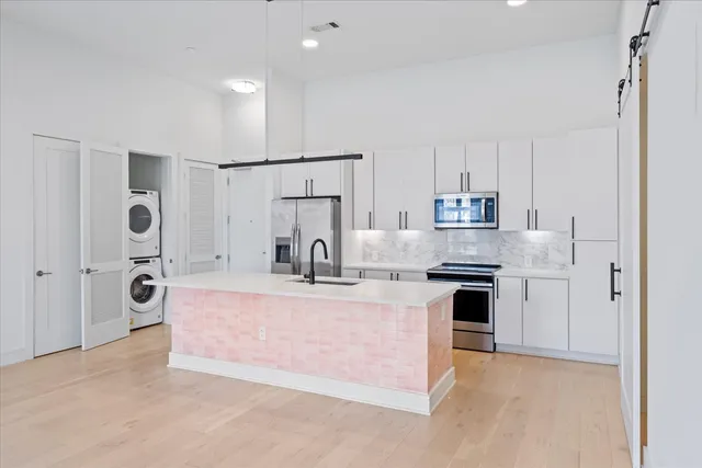 a view of kitchen with refrigerator stove sink and stove