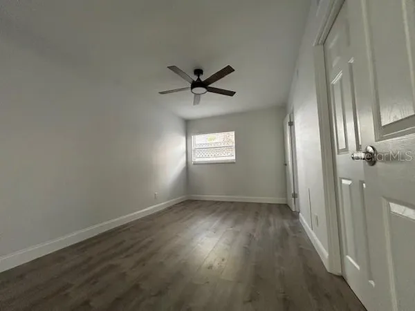 a view of an empty room with a window