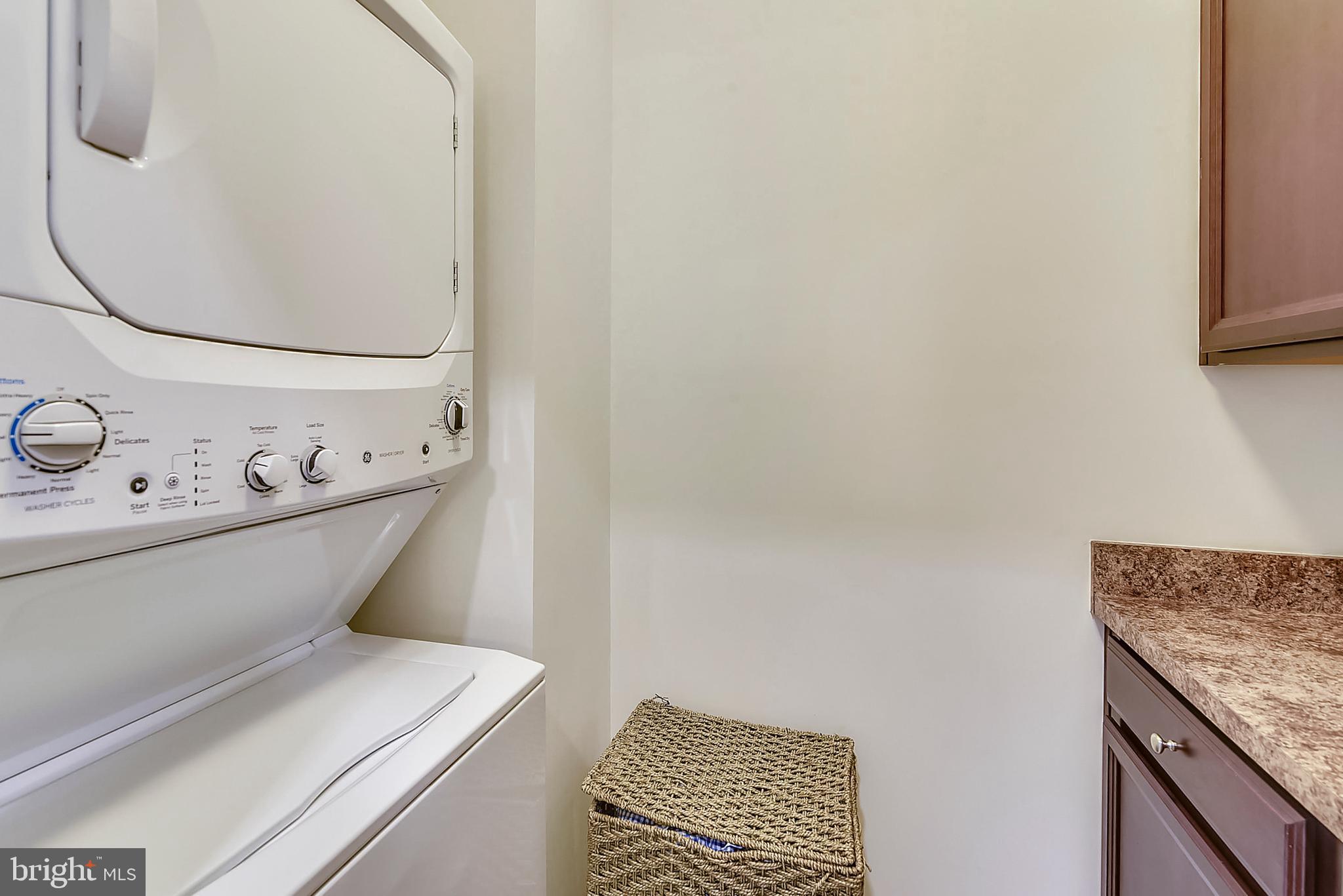 8010 Orchard Grove Road Odenton, MD 21113 - Photo 34 of 40 Laundry Room with Cabinetry & Folding Table