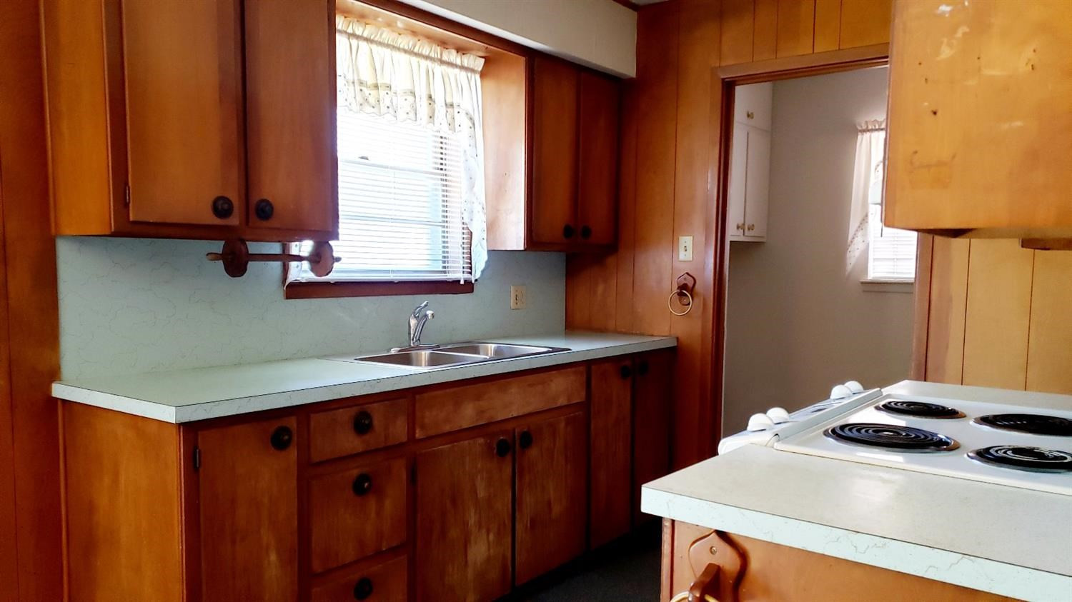 5419 46th Street Lubbock, TX 79414 - Photo 13 of 36 a kitchen with stainless steel appliances a sink a stove and a refrigerator