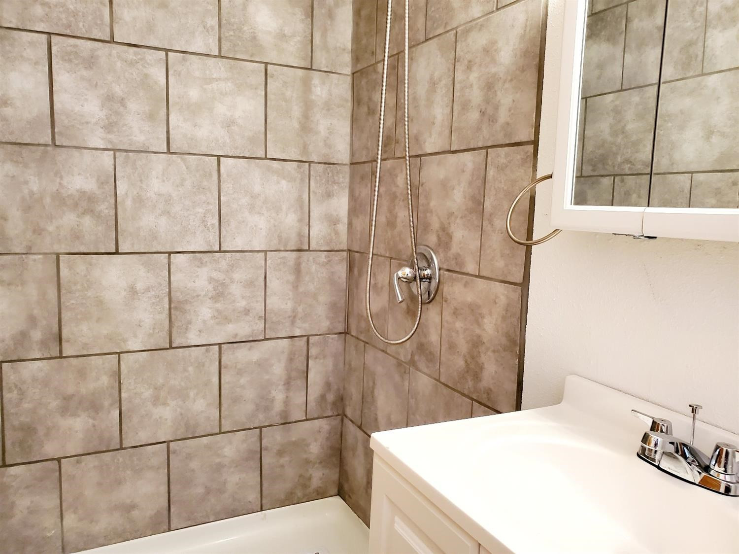 5419 46th Street Lubbock, TX 79414 - Photo 20 of 36 a bathroom with a sink and shower