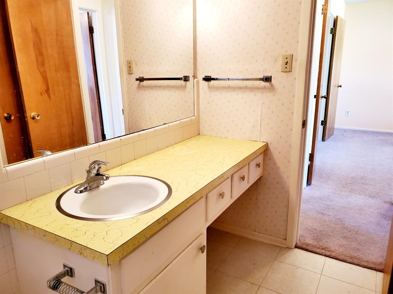 5419 46th Street Lubbock, TX 79414 - Photo 29 of 36 a bathroom with a sink and a mirror