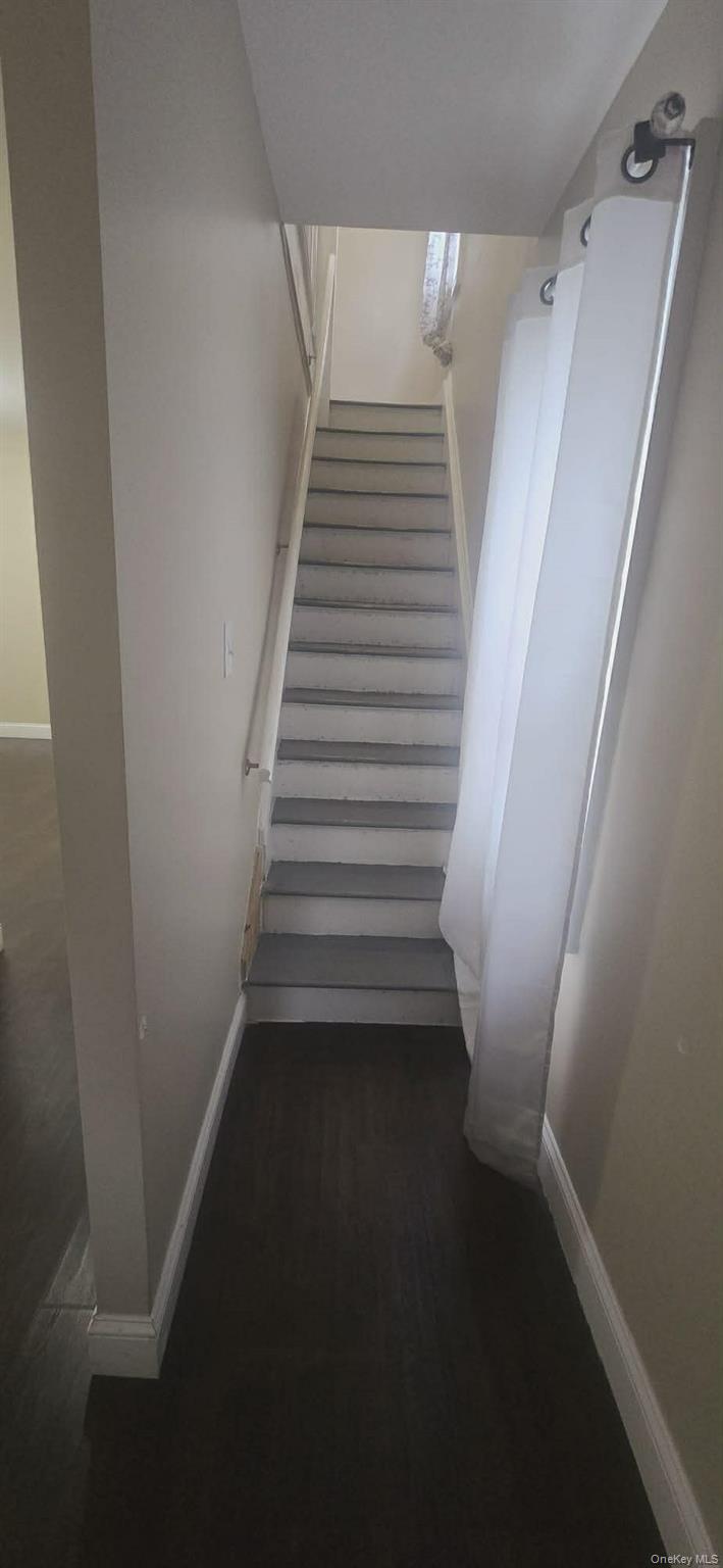 108-24 Springfield Boulevard Queens, NY 11429 - Photo 8 of 10 Stairs with baseboards