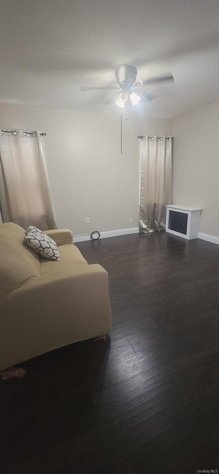 108-24 Springfield Boulevard Queens, NY 11429 - Photo 9 of 10 Bedroom with ceiling fan and dark wood-style floors