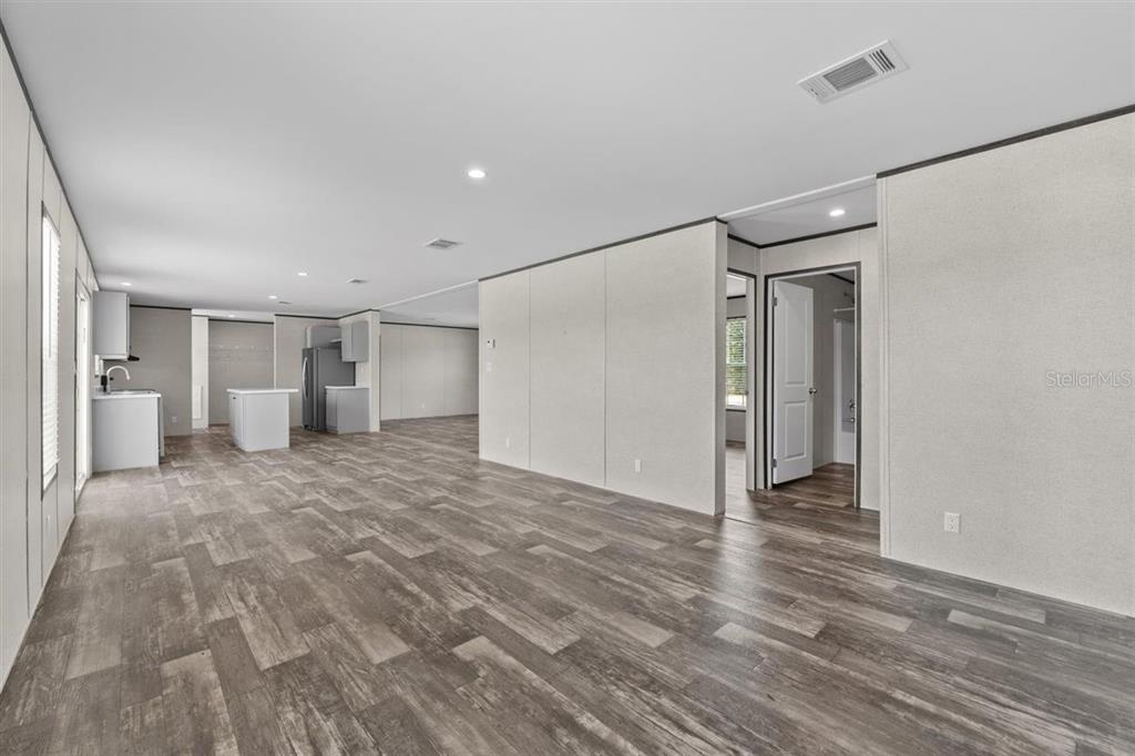 0 Rose Trail Hawthorne, FL 32640 - Photo 13 of 36 a view of a big room with wooden cabinet and windows