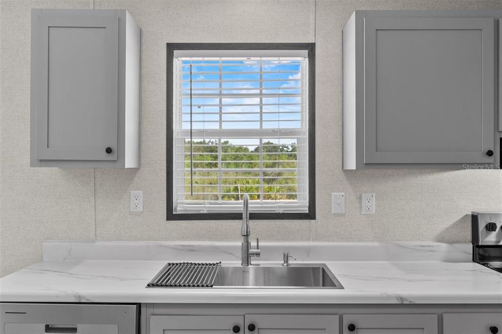 0 Rose Trail Hawthorne, FL 32640 - Photo 18 of 36 a kitchen with a sink and large window
