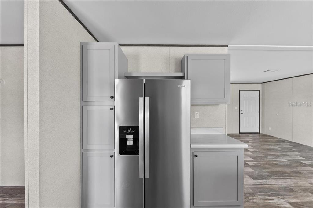 0 Rose Trail Hawthorne, FL 32640 - Photo 20 of 36 a metallic refrigerator freezer sitting in a kitchen