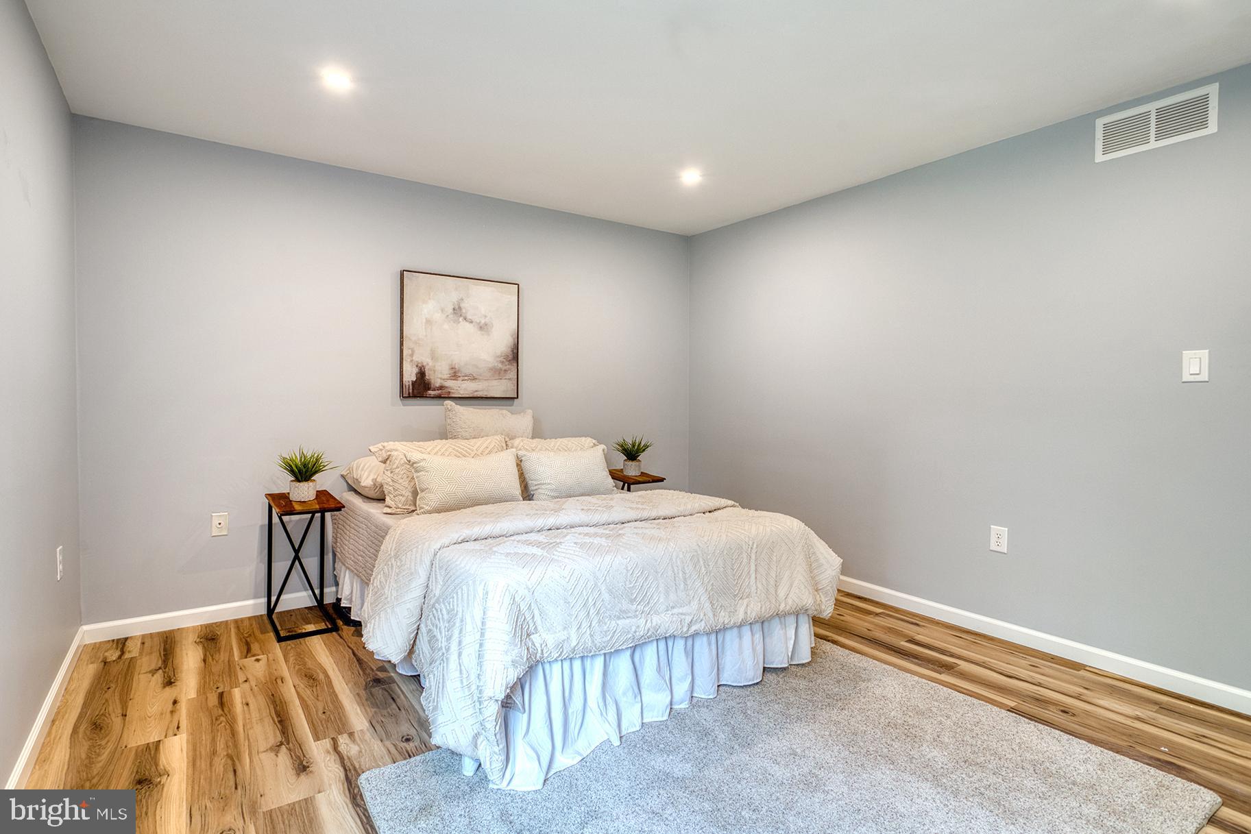4108 Century Towne Road Randallstown, MD 21133 - Photo 22 of 51 a bedroom with a bed and painting on the wall