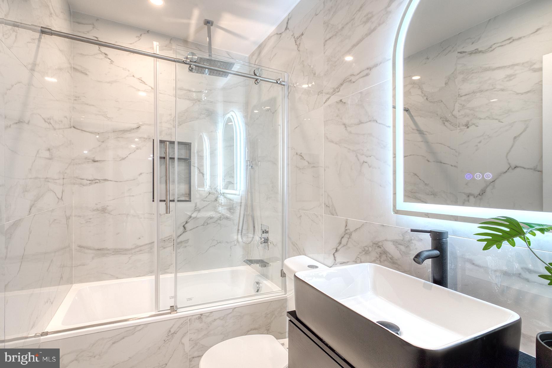4108 Century Towne Road Randallstown, MD 21133 - Photo 27 of 51 a bathroom with a bathtub shower sink and toilet
