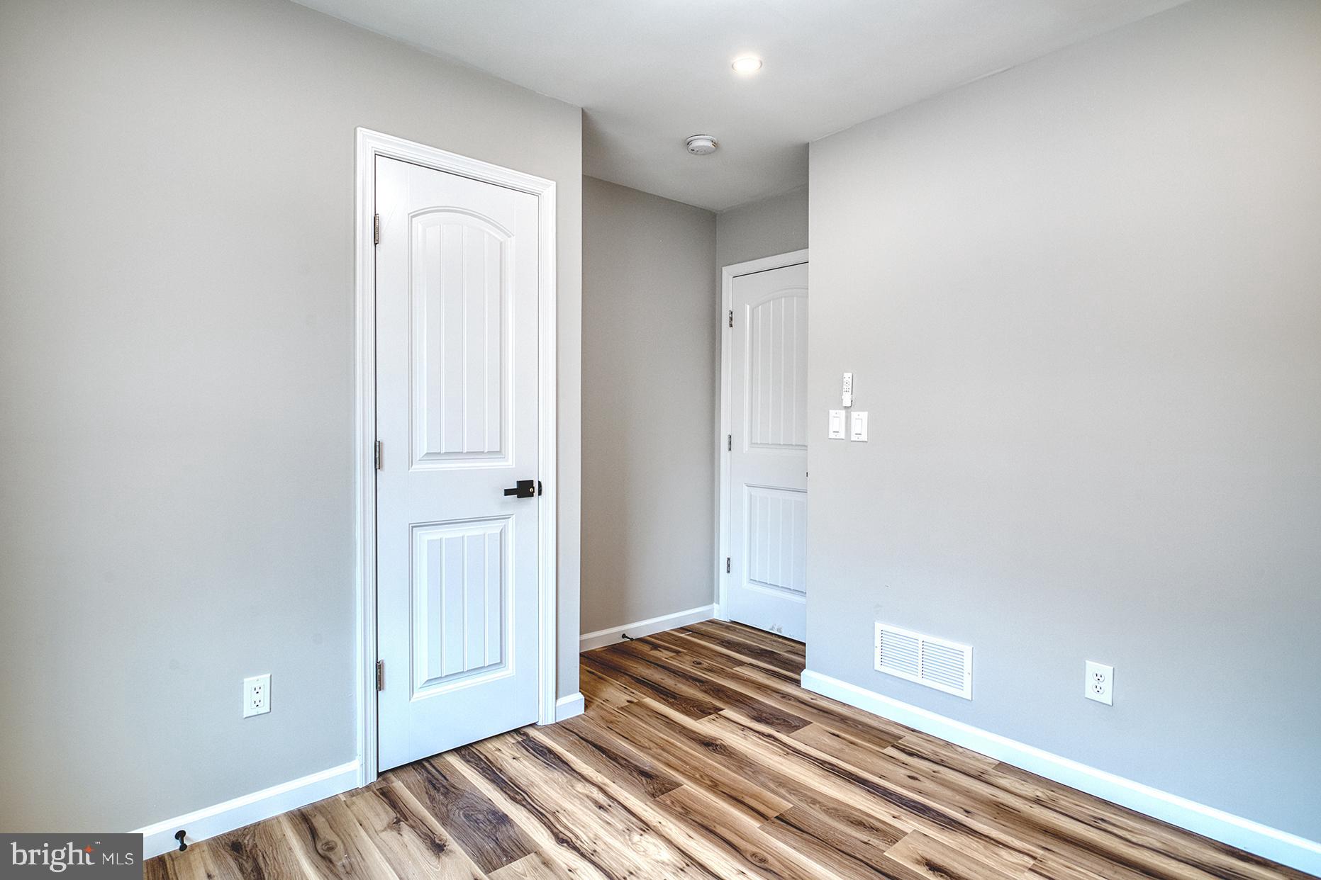 4108 Century Towne Road Randallstown, MD 21133 - Photo 31 of 51 a view of a bedroom with wooden floor