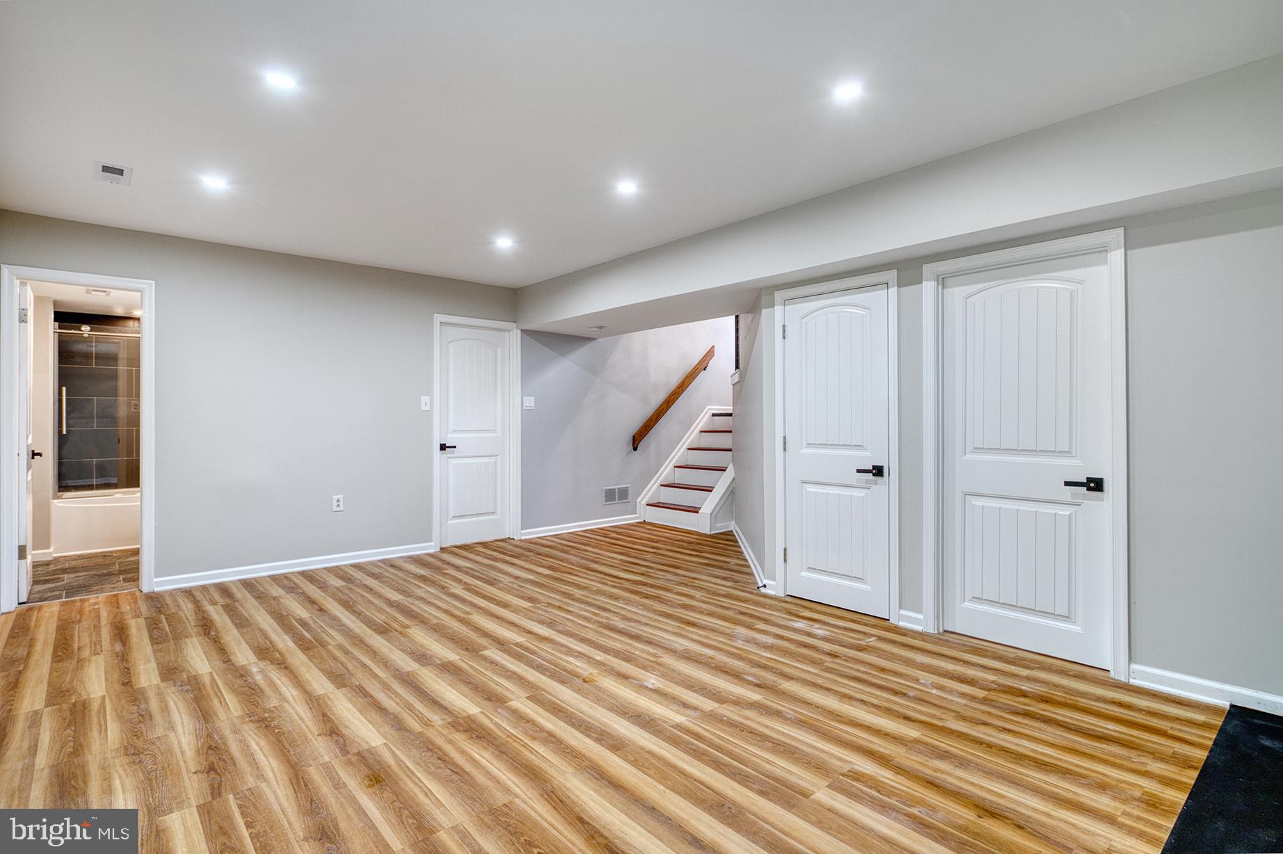 4108 Century Towne Road Randallstown, MD 21133 - Photo 33 of 51 a view of a bedroom with wooden floor and stairs