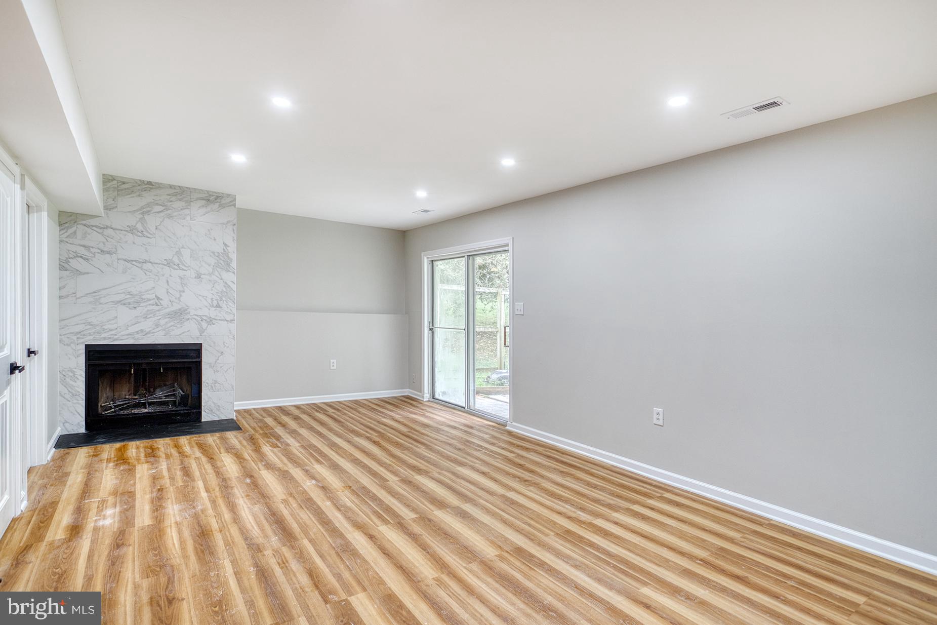 4108 Century Towne Road Randallstown, MD 21133 - Photo 35 of 51 a view of an empty room with a fireplace