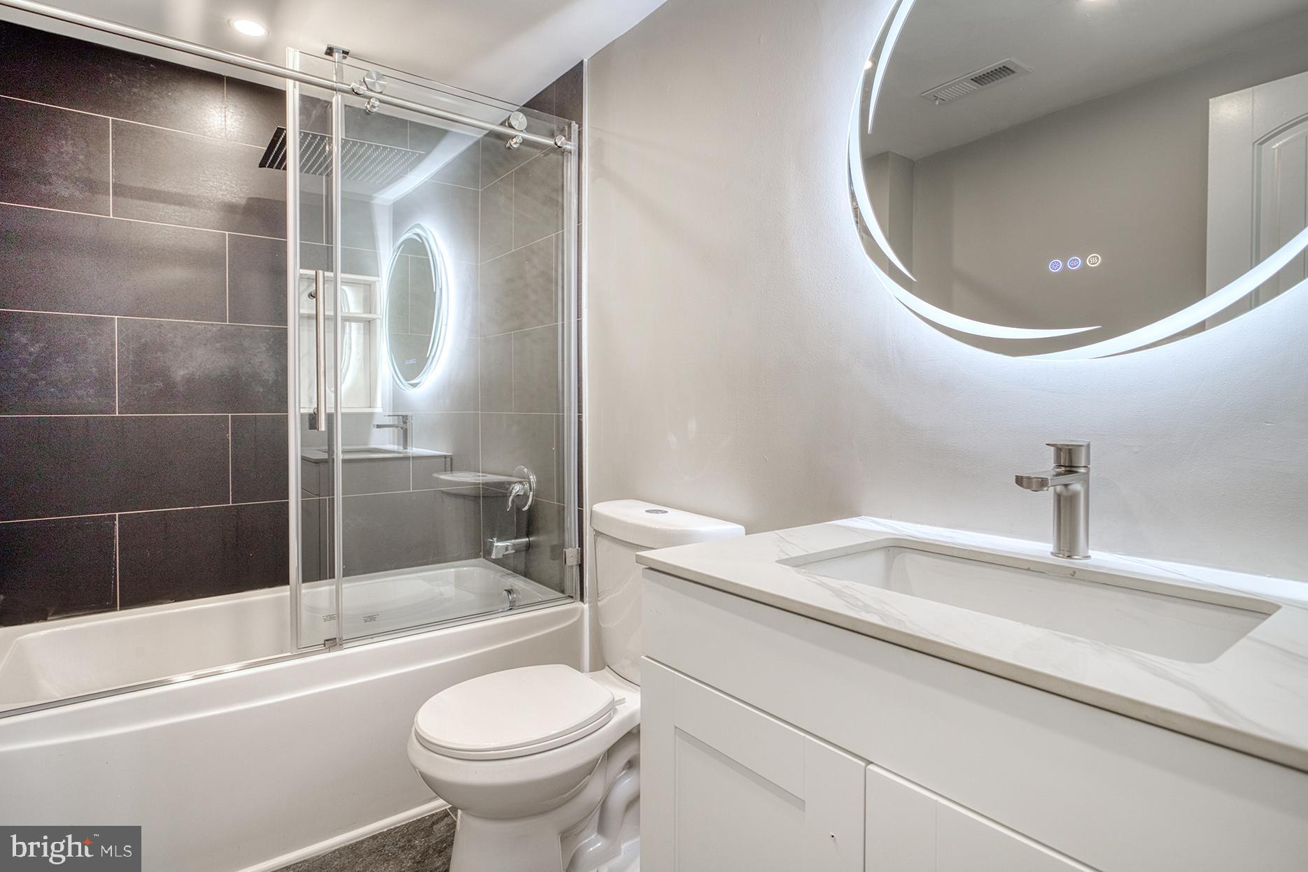 4108 Century Towne Road Randallstown, MD 21133 - Photo 37 of 51 a bathroom with a sink a toilet and shower